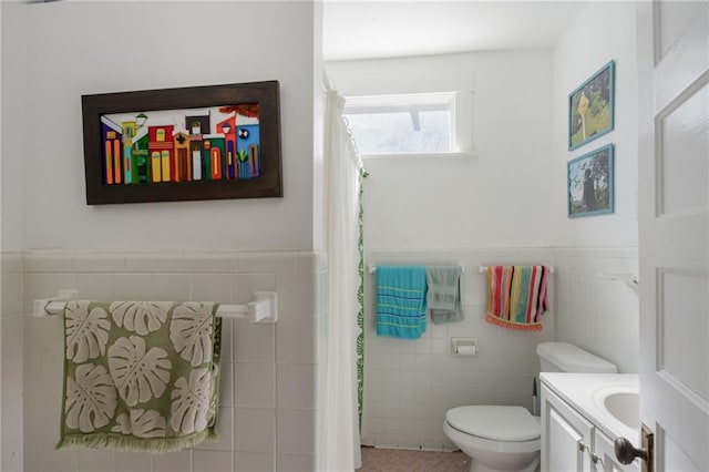 221012 Pine St, New Orleans, LA 70118 - bathroom with tile walls, vanity, wainscoting, and a shower with shower curtain