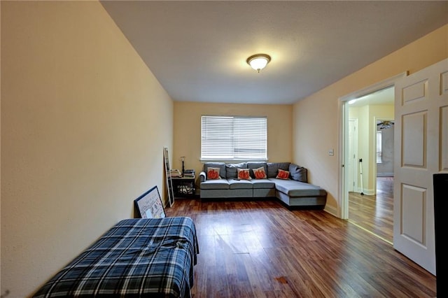 7701 Allison Rd, New Orleans, LA 70126 - living area featuring dark wood-style flooring and baseboards