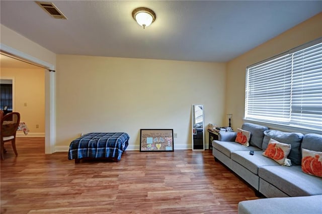 7701 Allison Rd, New Orleans, LA 70126 - living room with light wood finished floors and baseboards
