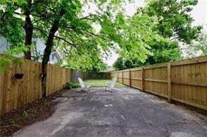 324 N Roman St, New Orleans, LA 70112 - fenced backyard featuring a patio