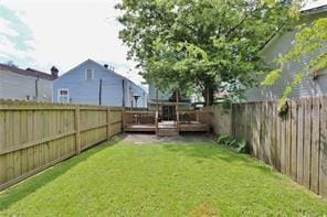 324 N Roman St, New Orleans, LA 70112 - view of yard featuring a wooden deck