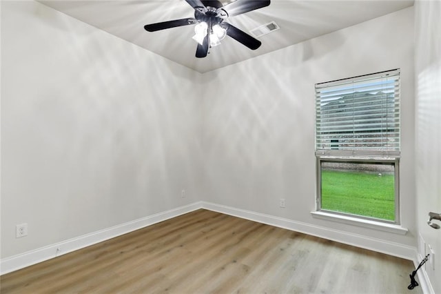 130 Palm Beach Blvd, Madisonville, LA 70447 - empty room with wood finished floors, baseboards, and ceiling fan