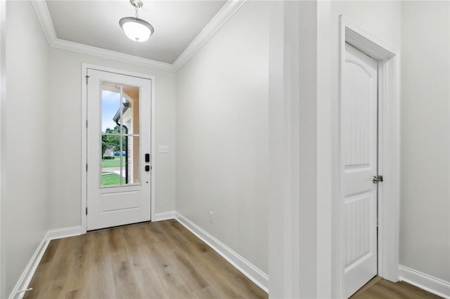 130 Palm Beach Blvd, Madisonville, LA 70447 - entryway with ornamental molding, wood finished floors, and baseboards