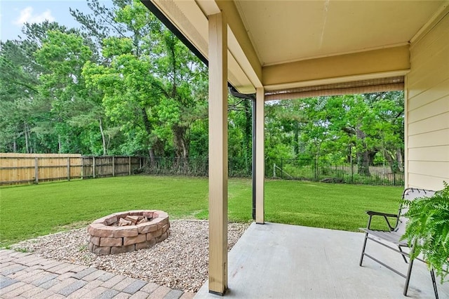 130 Palm Beach Blvd, Madisonville, LA 70447 - view of patio with an outdoor fire pit and view of scattered trees