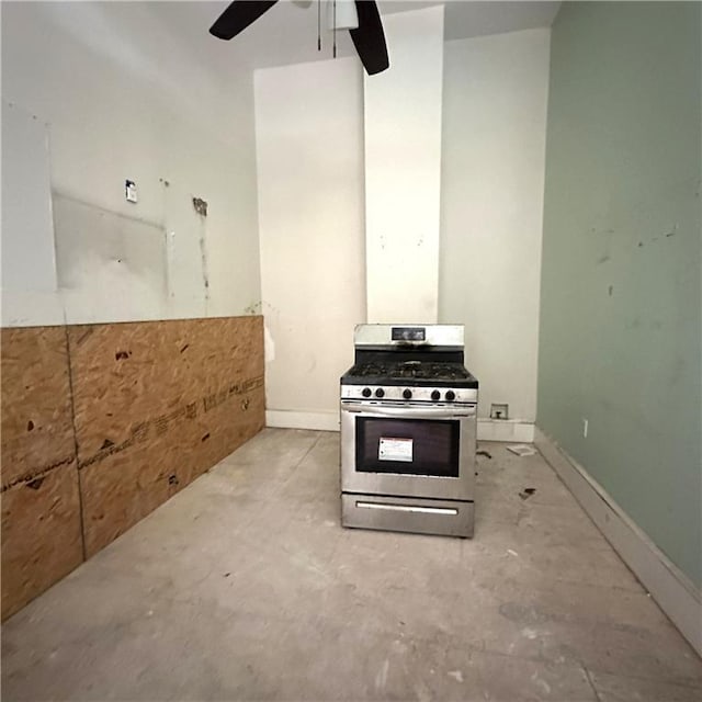 1432-1434 Ursulines Ave, New Orleans, LA 70116 - kitchen featuring stainless steel range with gas cooktop, ceiling fan, concrete flooring, and baseboards