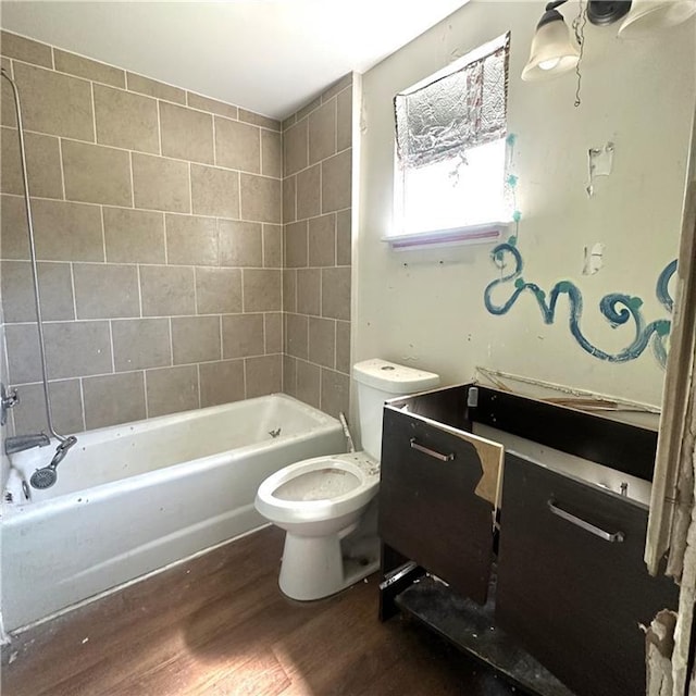 1432-1434 Ursulines Ave, New Orleans, LA 70116 - bathroom featuring wood finished floors, toilet, vanity, and shower / bathtub combination