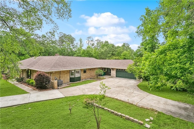 505 Hermitage Ct, Pearl River, LA 70452 - ranch-style house featuring concrete driveway, a garage, a front lawn, central air condition unit, and brick siding