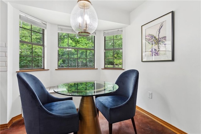 505 Hermitage Ct, Pearl River, LA 70452 - dining area with baseboards, healthy amount of natural light, and a chandelier
