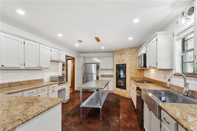 505 Hermitage Ct, Pearl River, LA 70452 - kitchen with black appliances, concrete flooring, backsplash, light stone countertops, and recessed lighting