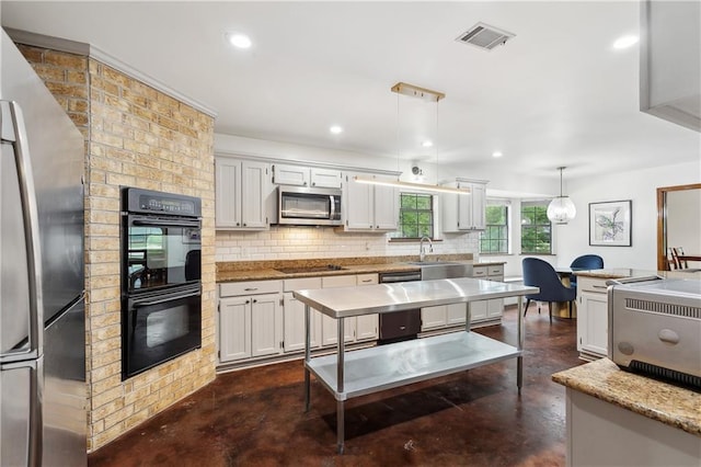 505 Hermitage Ct, Pearl River, LA 70452 - kitchen with black appliances, concrete flooring, backsplash, a sink, and recessed lighting