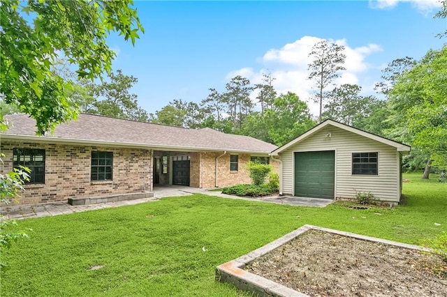 505 Hermitage Ct, Pearl River, LA 70452 - back of house featuring an outbuilding, a lawn, brick siding, and roof with shingles