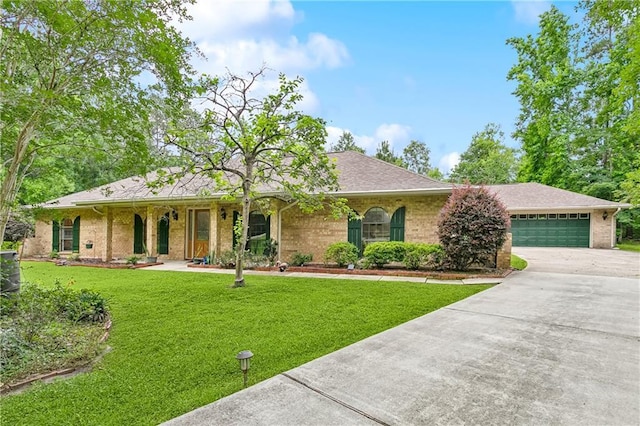505 Hermitage Ct, Pearl River, LA 70452 - ranch-style home featuring concrete driveway, a garage, a front yard, and brick siding