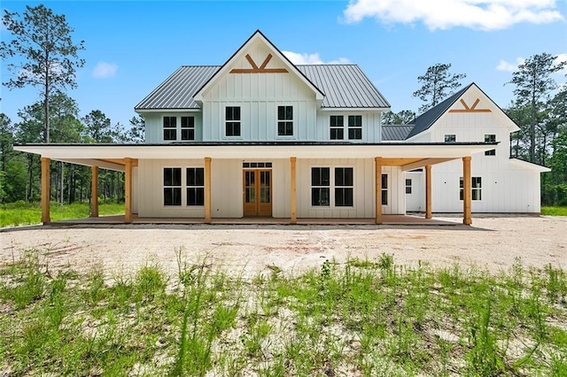 1190 Dove Park Rd, Covington, LA 70433 - back of house with board and batten siding, metal roof, and french doors