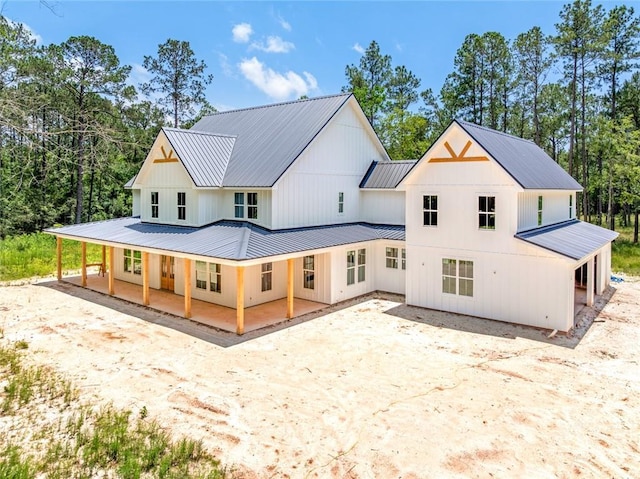 1190 Dove Park Rd, Covington, LA 70433 - back of property featuring metal roof, a porch, and a standing seam roof