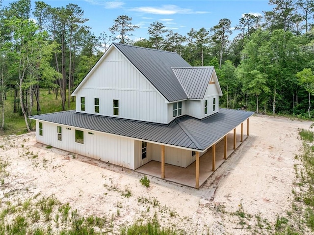 1190 Dove Park Rd, Covington, LA 70433 - back of property featuring metal roof and covered porch