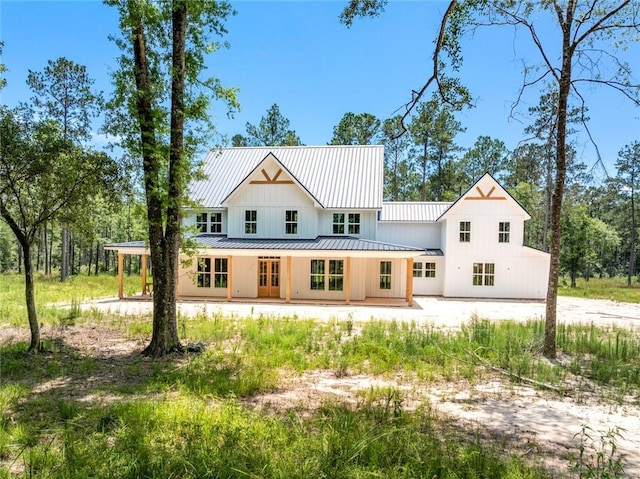 1190 Dove Park Rd, Covington, LA 70433 - back of house featuring a standing seam roof, metal roof, and board and batten siding