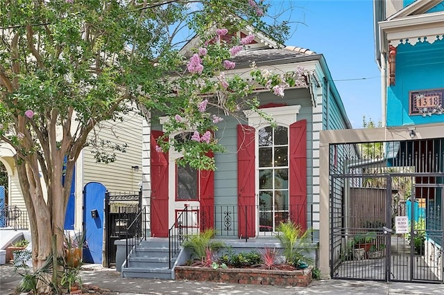 1314 Ursulines Ave, New Orleans, LA 70116 - view of front of home with a gate