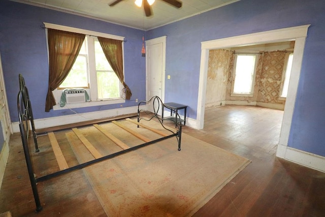 410 S Cherry St, Hammond, LA 70401 - unfurnished bedroom featuring baseboards, hardwood / wood-style flooring, ornamental molding, cooling unit, and ceiling fan