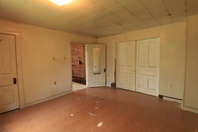 410 S Cherry St, Hammond, LA 70401 - unfurnished bedroom featuring a closet and wood walls