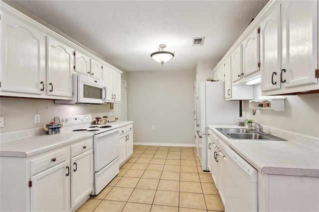 62088 Snow St, Lacombe, LA 70445 - kitchen featuring white appliances, a sink, white cabinets, light countertops, and a textured ceiling