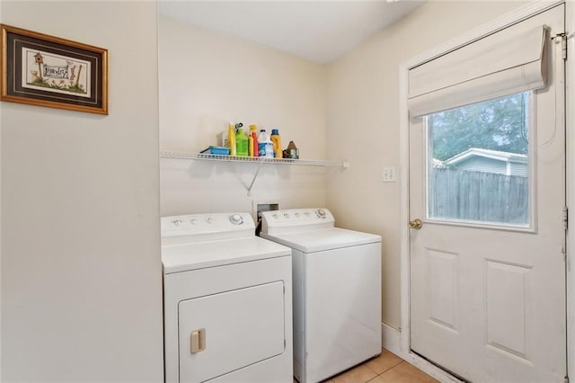 62088 Snow St, Lacombe, LA 70445 - laundry area featuring separate washer and dryer and light tile patterned floors