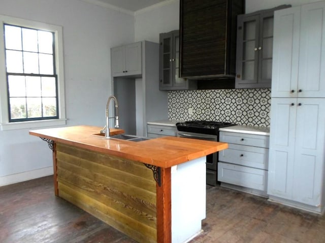 6315 Alhambra St, New Orleans, LA 70117 - kitchen with wood counters, a sink, stainless steel gas range oven, crown molding, and backsplash
