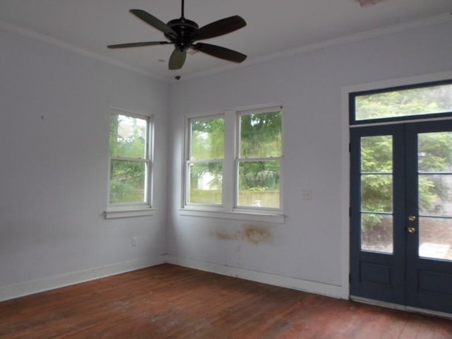 6315 Alhambra St, New Orleans, LA 70117 - entrance foyer featuring wood finished floors, french doors, crown molding, ceiling fan, and baseboards