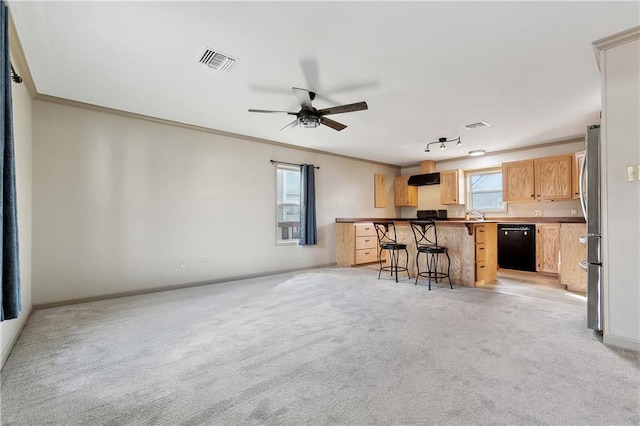 232 Janet Lynn Ct, Theriot, LA 70397 - kitchen featuring dishwasher, a breakfast bar area, light colored carpet, crown molding, and freestanding refrigerator