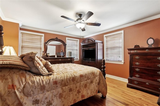 5878 General Diaz St, New Orleans, LA 70124 - bedroom with baseboards, light wood finished floors, crown molding, and a ceiling fan
