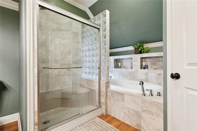 5878 General Diaz St, New Orleans, LA 70124 - full bath with a stall shower, a bath, and wood finished floors