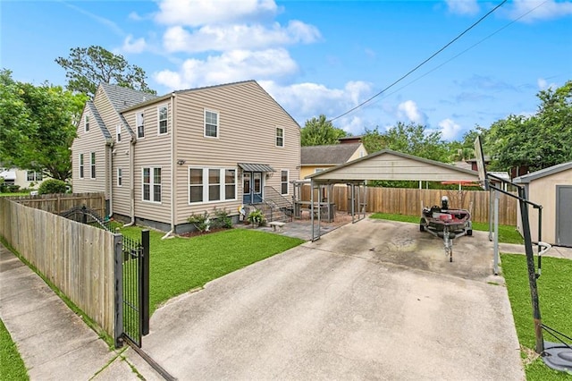 5878 General Diaz St, New Orleans, LA 70124 - rear view of property with a carport and driveway