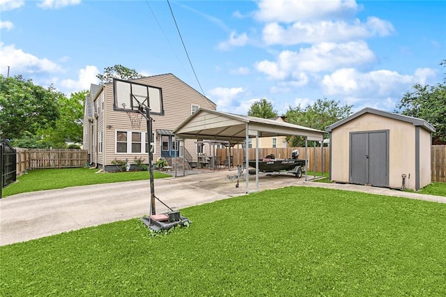 5878 General Diaz St, New Orleans, LA 70124 - back of house with a detached carport, driveway, and a patio