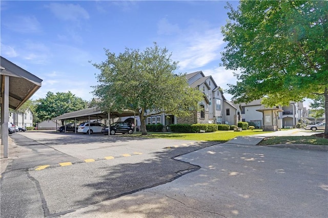 350 Emerald Forest Blvd Unit 9202, Covington, LA 70433 - covered parking lot featuring a residential view