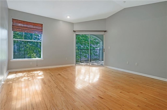 350 Emerald Forest Blvd Unit 9202, Covington, LA 70433 - unfurnished room with light wood-style floors, vaulted ceiling, and baseboards