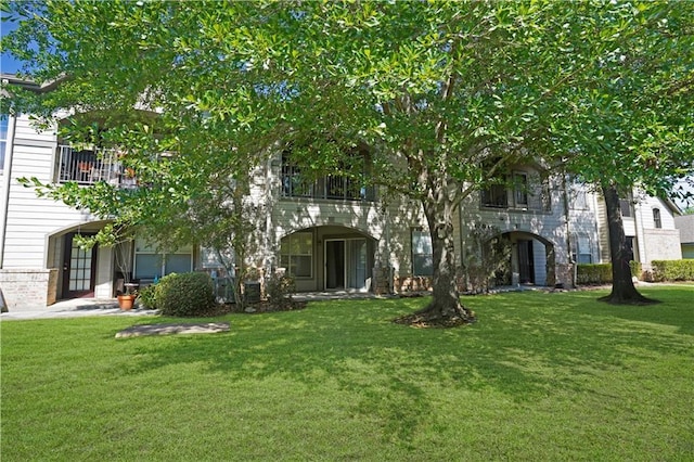 350 Emerald Forest Blvd Unit 9202, Covington, LA 70433 - view of front of home featuring a front yard and a balcony