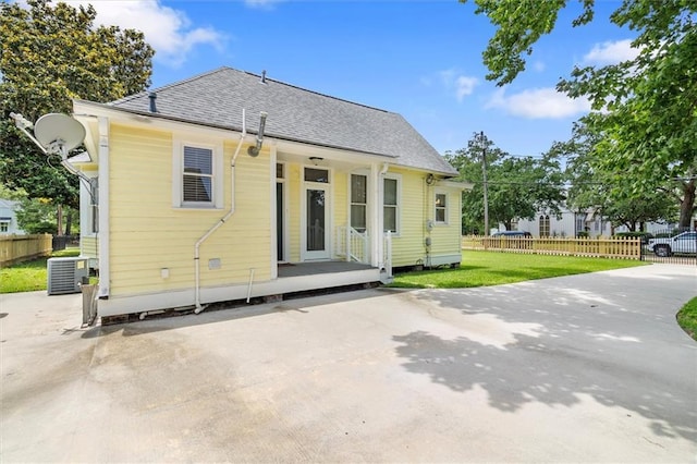 312 N Oak St, Hammond, LA 70401 - back of property featuring central AC and a shingled roof