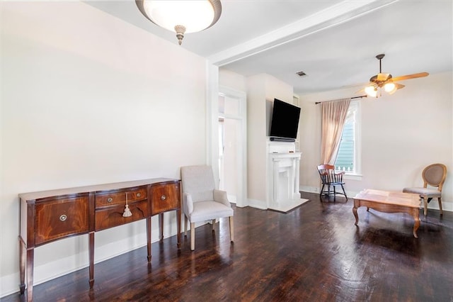 312 N Oak St, Hammond, LA 70401 - living area with wood finished floors, ceiling fan, a fireplace, and baseboards