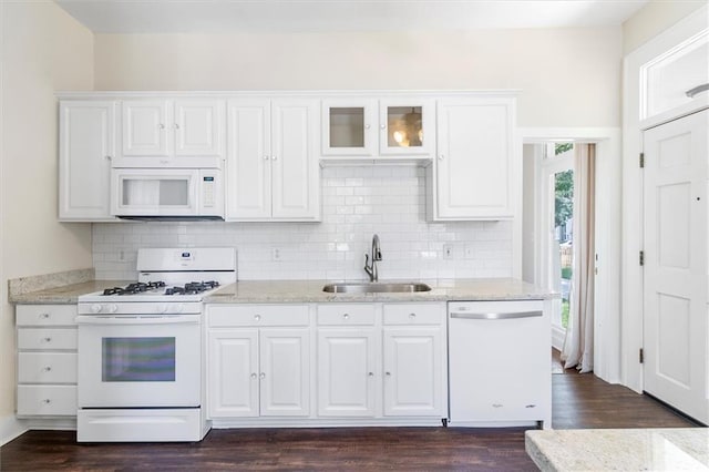 312 N Oak St, Hammond, LA 70401 - kitchen featuring white appliances, a sink, dark wood-style flooring, and white cabinetry