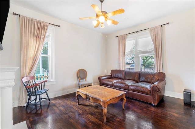 312 N Oak St, Hammond, LA 70401 - living area featuring wood finished floors, a ceiling fan, and baseboards