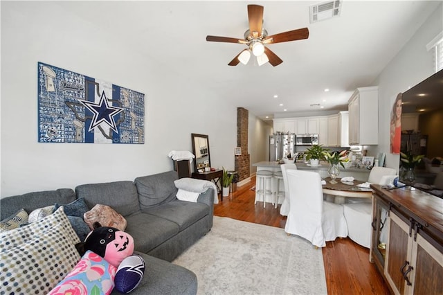491113 Willow St, New Orleans, LA 70115 - living room with wood finished floors, ceiling fan, recessed lighting, and baseboards