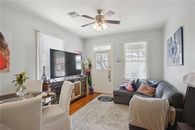 491113 Willow St, New Orleans, LA 70115 - living area with a ceiling fan and wood finished floors