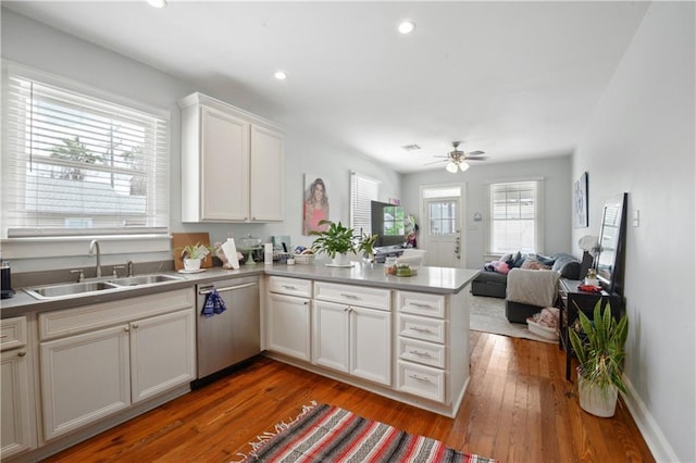 491113 Willow St, New Orleans, LA 70115 - kitchen with a sink, dishwasher, ceiling fan, a peninsula, and open floor plan