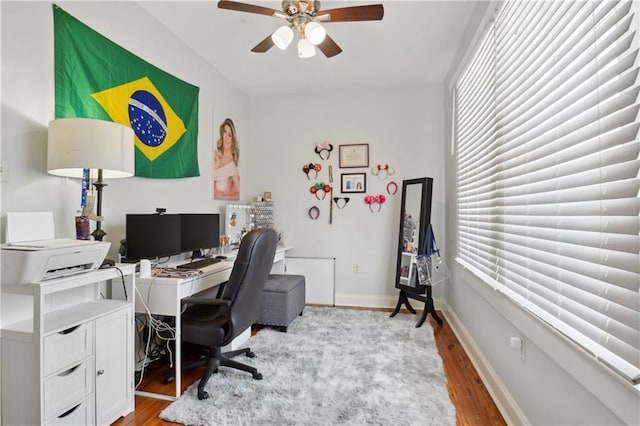 491113 Willow St, New Orleans, LA 70115 - office with light wood-style floors, a ceiling fan, and baseboards