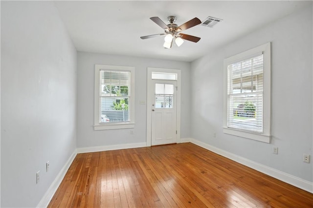 491113 Willow St, New Orleans, LA 70115 - foyer entrance with hardwood / wood-style floors, a ceiling fan, and baseboards