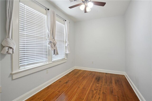 491113 Willow St, New Orleans, LA 70115 - spare room with ceiling fan, wood-type flooring, and baseboards