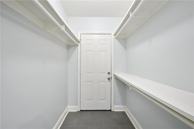 491113 Willow St, New Orleans, LA 70115 - spacious closet featuring dark tile patterned flooring
