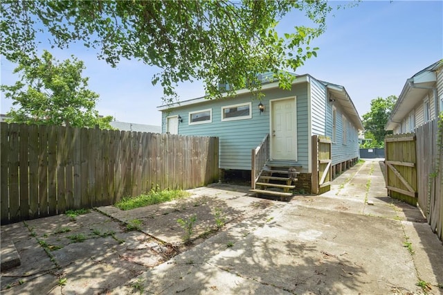 491113 Willow St, New Orleans, LA 70115 - rear view of property featuring entry steps and a patio