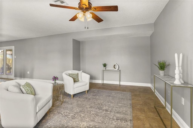 6020 Loraine St, Metairie, LA 70003 - sitting room featuring ceiling fan, baseboards, and a textured ceiling