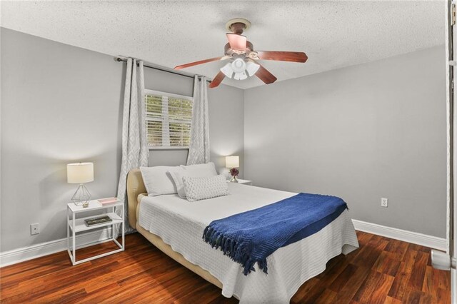 6020 Loraine St, Metairie, LA 70003 - bedroom with baseboards, a textured ceiling, wood finished floors, and a ceiling fan