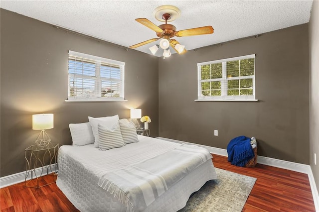 6020 Loraine St, Metairie, LA 70003 - bedroom with baseboards, wood finished floors, a textured ceiling, and ceiling fan